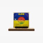 Vintage Ajda music vinyl cover with blue and yellow design displayed on a wooden pedestal.