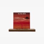 Album cover featuring a red gradient desert landscape with grid mountains and a black sun, 'ALTIN GÜN' at top and repeated text at bottom, on a wooden shelf.