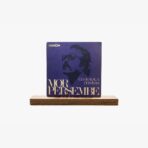 Purple album cover with a silhouette of a man wearing glasses, reading 'MOR PERŞEMBE' and 'CEM KARACA DERVİSAN' on a wooden stand.